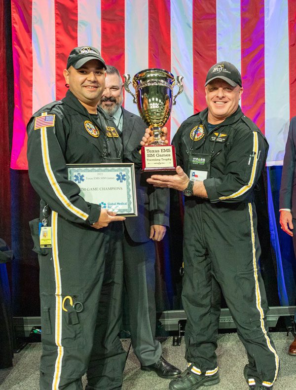 Winners of 2022 Texas EMS SIM Games at Texas EMS Conference holding trophy.