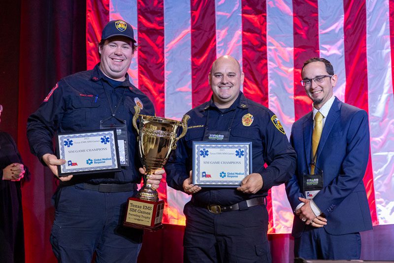 Winners of 2022 Texas EMS SIM Games at Texas EMS Conference holding trophy.