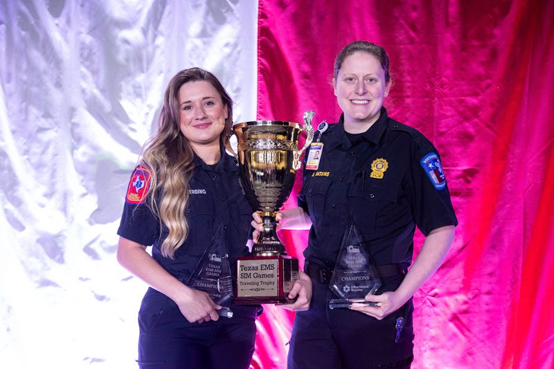 Winners of 2022 Texas EMS SIM Games at Texas EMS Conference holding trophy.