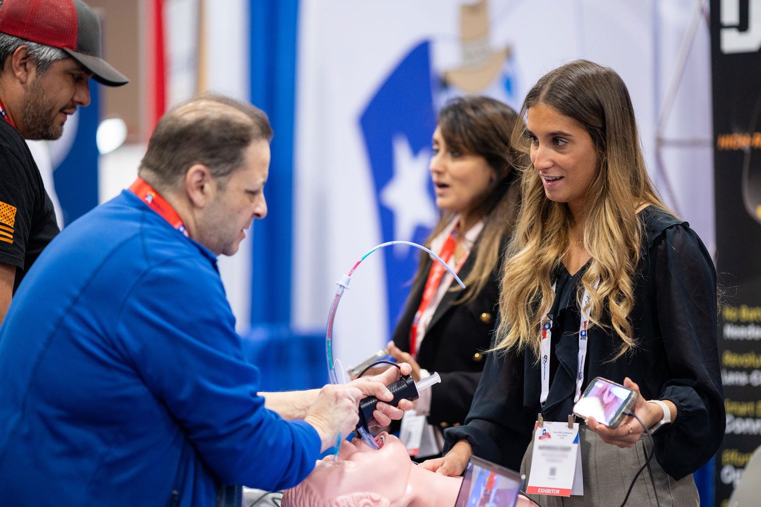 Exhibitor demonstrating a product to attendees | Texas EMS Conference