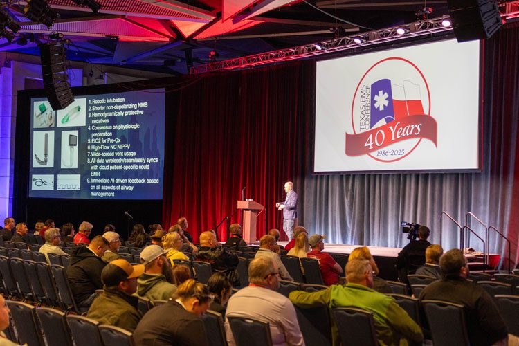 Speaker presenting closing session to large ballroom crowd | Texas EMS Conference